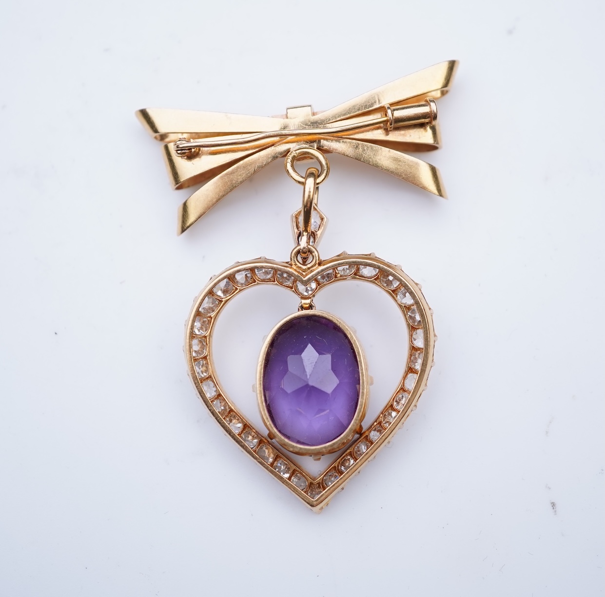 A synthetic sapphire and diamond pendant, mid 20th century